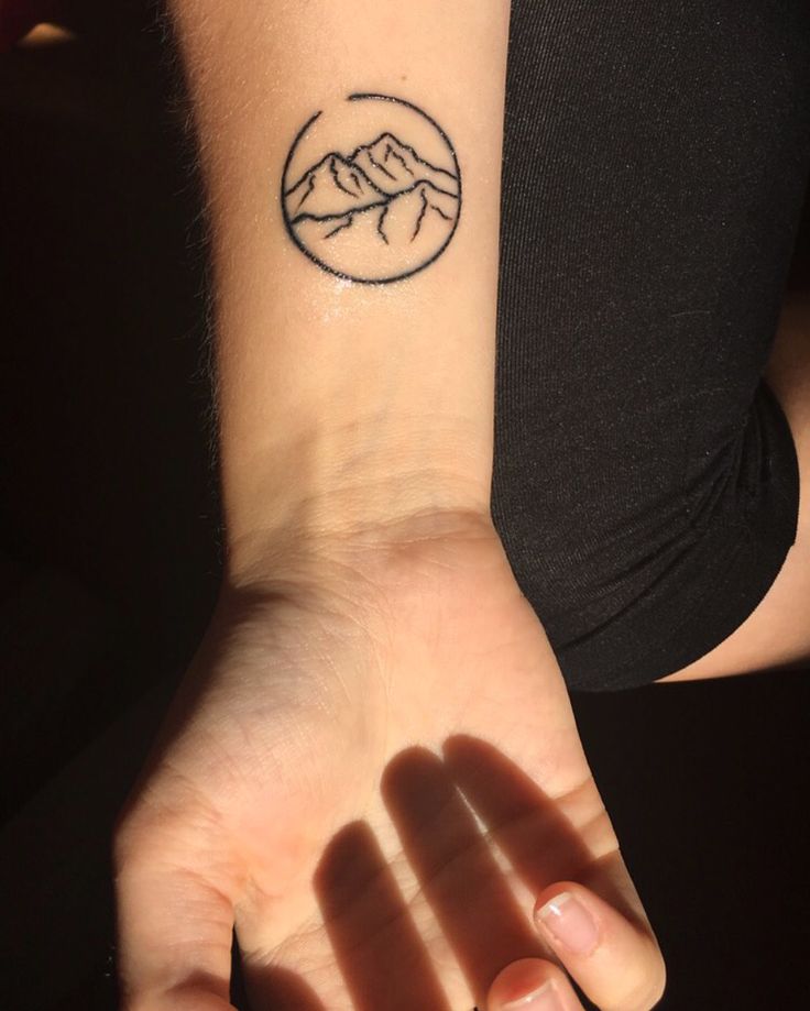 minimalist mountain tattoo wrist