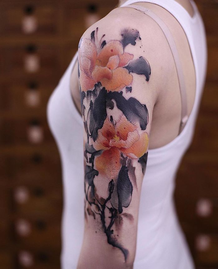 Watercolor tattoo - He creates these intricate watercolor tattoos that