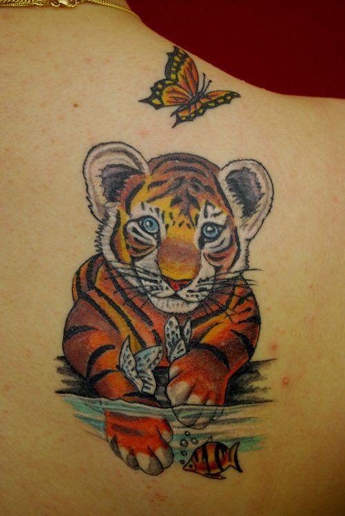 Women Tattoo Tiger Tattoo Small Baby Tiger And A Butterfly Tattoo On A Woman S Shoulder Tattooviral Com Your Number One Source For Daily Tattoo Designs Ideas Inspiration