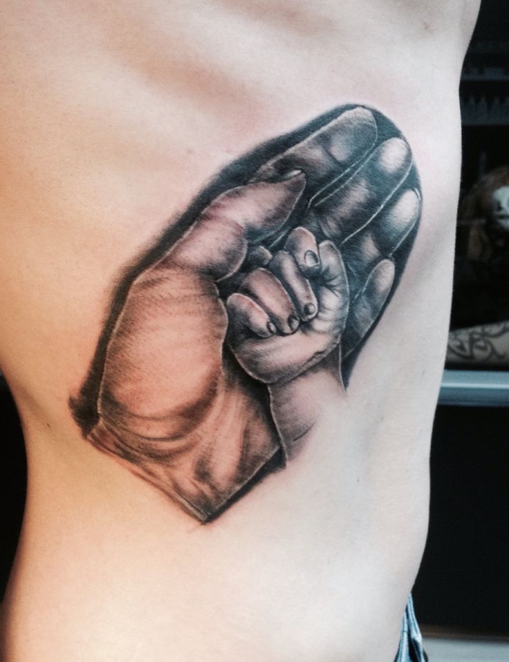 Meaningful Tattoos - Hand holding babyhand tattoo - TattooViral.com ...