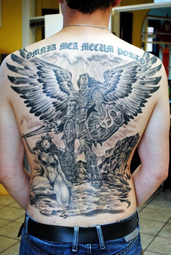 Detail of large male angel tattoo on young woman's back Stock Photo - Alamy