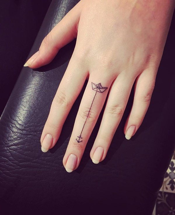 Small White Anchor Finger Tattoo